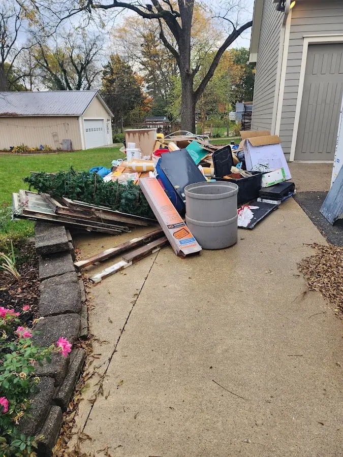 Dumpster being loaded with debris for Commercial Dumpster Rental in Houston